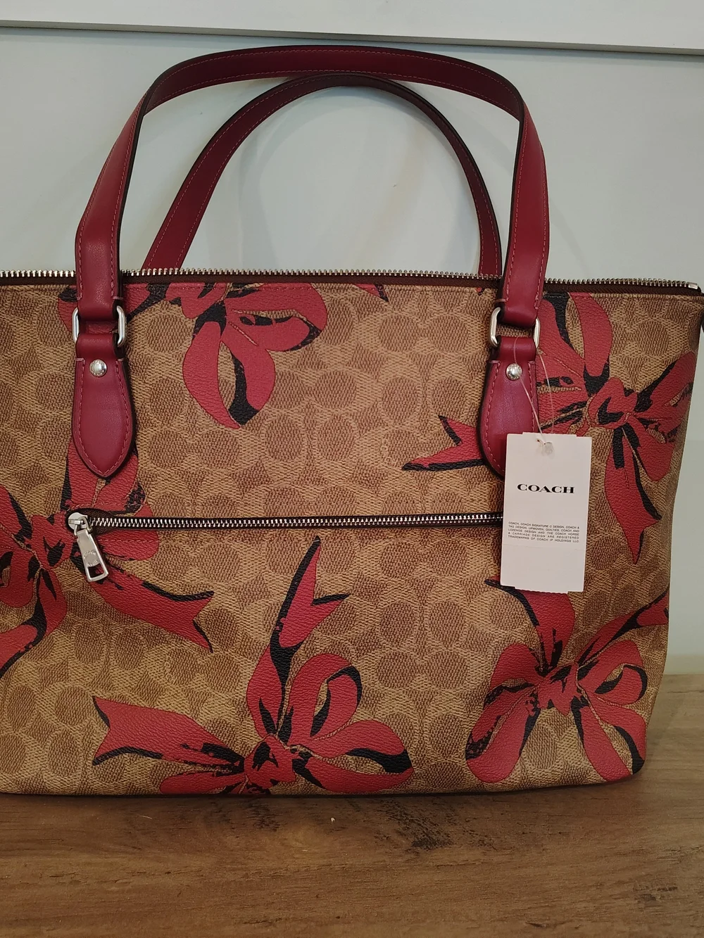 Coach Brown Signature Tote with Pink Bow Accents